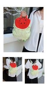 Detail of watermelon themed backpack with red interior flap and green fabric texture