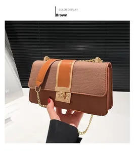Detailed view of the brown tweed and leather patchwork bag with gold chain strap