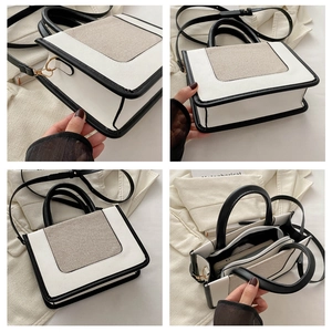 Detail of multi-compartment interior and gold metal hardware on color-block crossbody bag