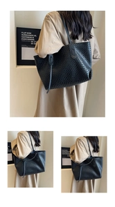 Detailed close-up of high-quality woven PU leather texture on a black tote bag