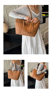 Detail of a brown tote bag featuring bear prints and dual shoulder straps for daily use