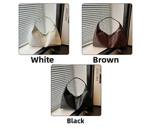 Three minimalist leather hobo bags in white, brown and black colors with shadow lighting