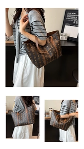 Detail of vintage brown tote bag with bear pattern worn by a model in a cafe setting