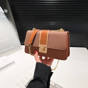 Brown and khaki patchwork shoulder bag with gold chain strap and turn-lock closure