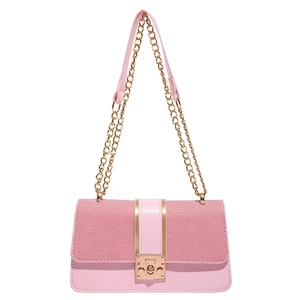 Pink crossbody bag with chain strap and gold hardware in a minimalist square design