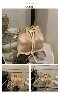Close-up of khaki drawstring bucket bag showing premium matte texture and metal eyelets