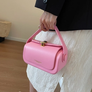 Pink leather handbag for women featuring a minimalist square design and gold metal buckle