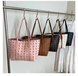 Detail view of large capacity leather tote bags with bear pattern in five classic colors