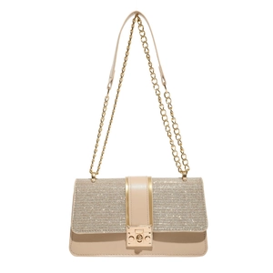 Fashionable beige leather crossbody bag with gold glitter flap and chain strap