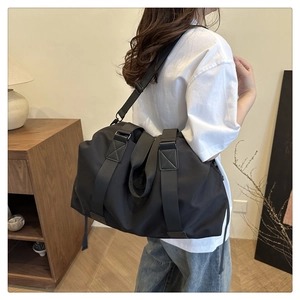 Detail of waterproof Oxford fabric travel bag with reinforced stitching and handle