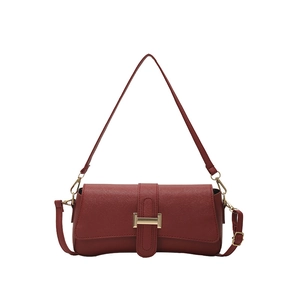 Deep red Saffiano faux leather underarm shoulder bag with a gold rectangular metal buckle