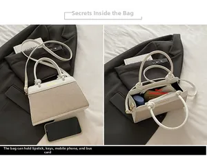 Internal view and size comparison of a minimalist contrast-color linen handbag with phone
