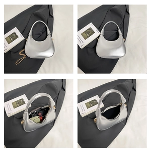 Detailed interior and side view of a silver hobo bag showing capacity for daily essentials