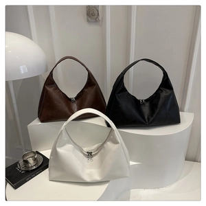 Detailed comparison of minimalist hobo bags in dark brown, classic black, and cream leather