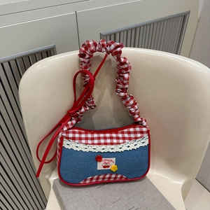 Contrast color patchwork tote bag with cherry patch and lace trim on a white background