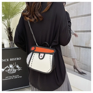 Detail of 2D cartoon style crossbody bag with bold black outlines and metal chain strap