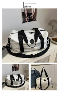 Detail shot of white Oxford gym bag with black straps and fashion 1 logo in lifestyle setting