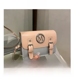 Detail of pink and silver color-block crossbody bag with metal M logo and buckled straps