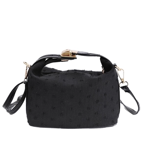Vintage black textured yuanbao shaped crossbody handbag with golden buckle closure