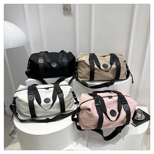 Multiple colors of large travel bags including black, khaki, white, and pink options