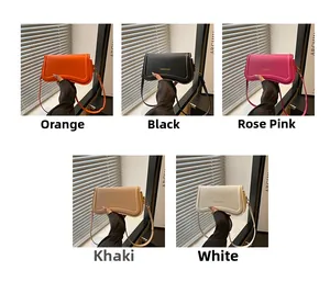 Selection of five stylish leather shoulder bags in various colors with gold lettering