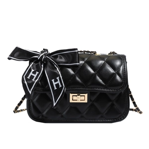 Black quilted rhombic chain bag with golden clasp and a decorative H letter silk bow