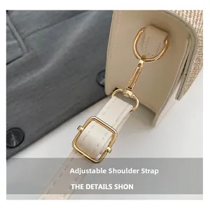 Detail of adjustable shoulder strap with gold hardware on minimalist patchwork handbag