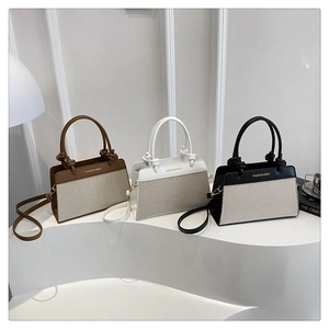 Three minimalist canvas and PU leather tote bags in brown, white, and black colors