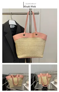 Detail of khaki pink straw tote bag with woven texture and leather handle