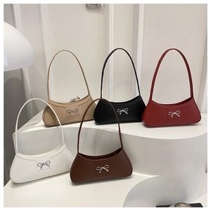 Detailed display of baguette shoulder bags in five colors with silver bow metallic decor