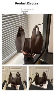 Detail of coffee brown oversized tote bag with adjustable strap and smooth matte finish
