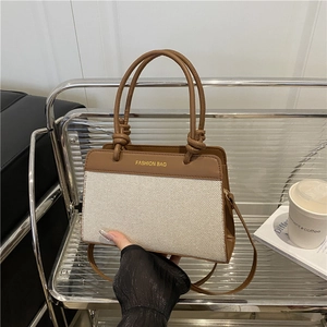 Sac à main chic en cuir marron et tissu tissé avec texte Fashion Bag et anses nouées
