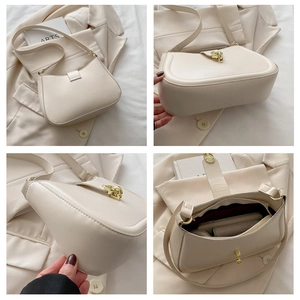 Dettagli della borsa a sella beige con fibbie dorate, tasche interne e trama della pelle