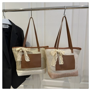 Detail of woven beach tote bags with leather pockets and delicate lace bow accents