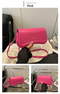 Detail of rose pink leather shoulder bag with gold hardware and FASHION & BAGS logo