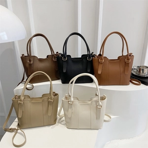 Retro lychee leather bucket bags in five colors on white display steps