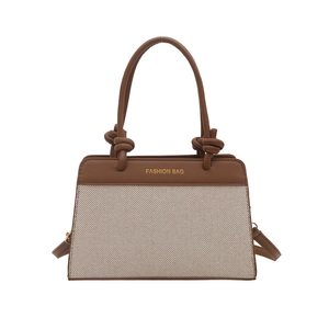 Brown leather and beige fabric trapezoid handbag with fashion text and knotted handles
