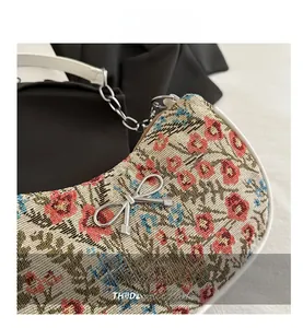 Detail of floral jacquard fabric with silver chain and bow knot metal buckle decoration