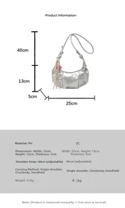 Detail view of silver crescent bag with pleated mirror finish and woven tassel charm