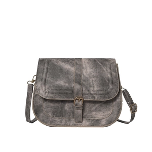 Retro grey denim saddle bag with beige trim and vintage metal buckle on white background
