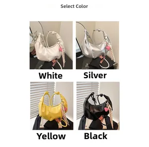 Chic dumpling bags in white, silver, yellow, and black with heart charms and scarves