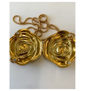 Detailed interior of rose-shaped acrylic clutch bag with magnetic closure and gold chain
