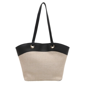 Retro woven straw tote bag with black leather straps for summer beach vacations