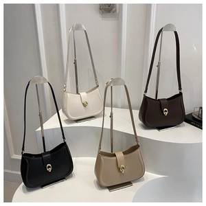 Four hobo bags in assorted colors displayed on a podium with elegant gold ring buckles