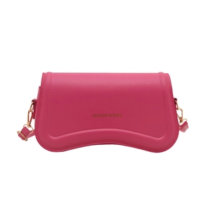 Minimalist fuchsia faux leather shoulder bag with gold text and curved bottom design