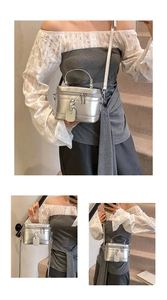 Macro detail of silver mini square bag showing metallic texture and crossbody strap