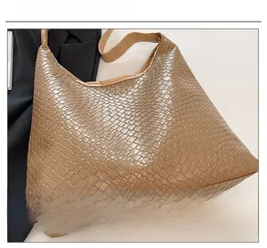 Close-up of the woven texture and premium synthetic leather material on the tote bag