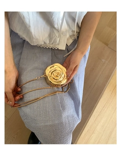 Detail shot of the golden 3D rose acrylic mini bag with shiny metallic finish and chain