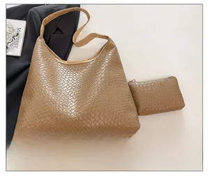 Detail of brown faux-woven tote bag set including a matching small zipper pouch