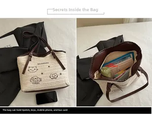 Detail view of woven tote bag showing spacious interior with embroidery and leather straps